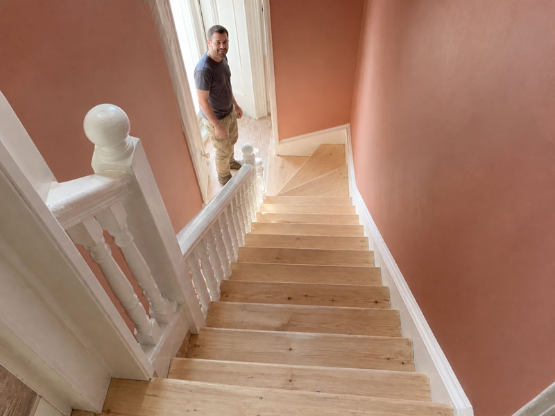 Finished staircase and landing, treads sanded back to bare wood and sealed with a clear finish