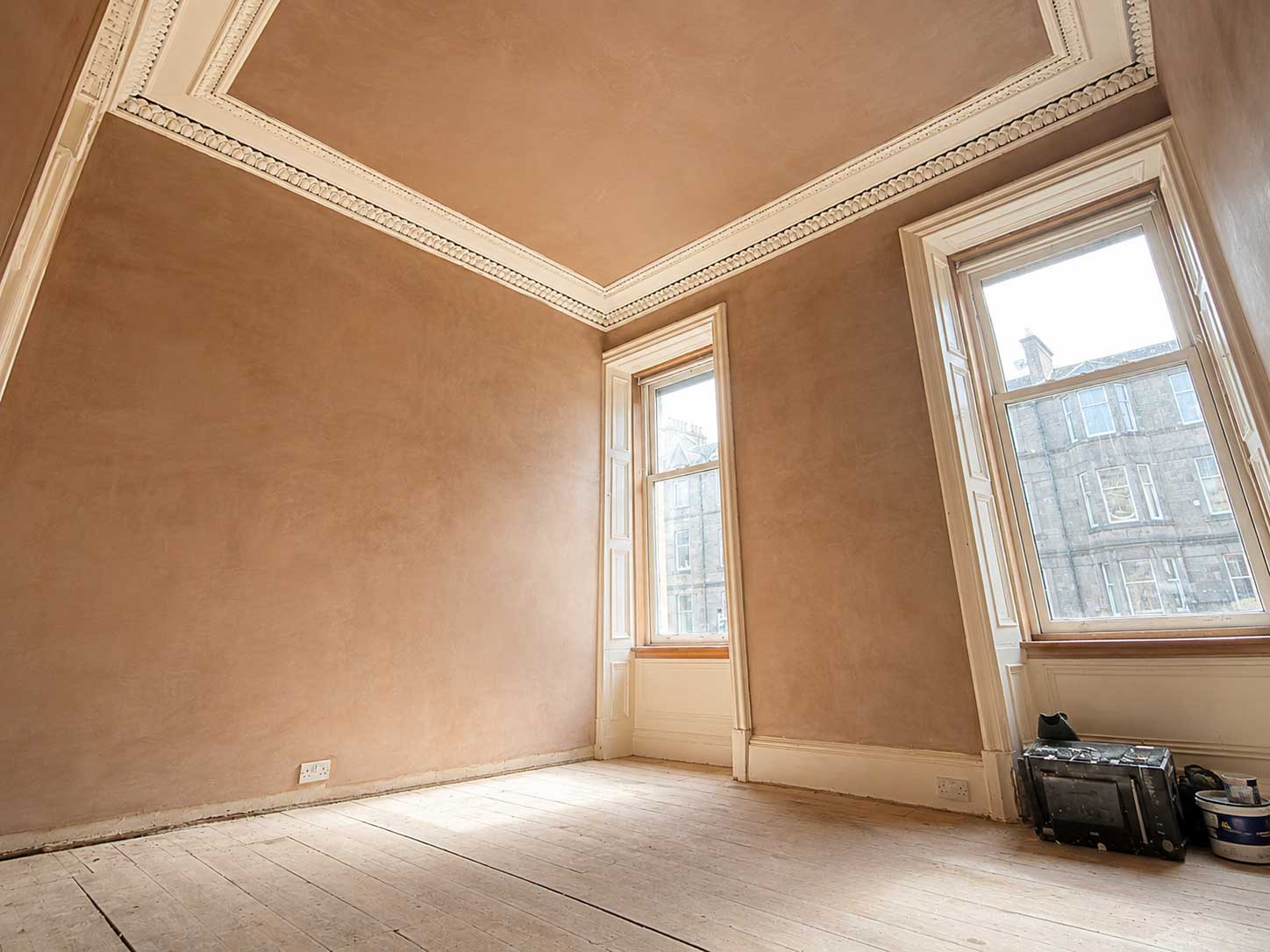 Freshly re-plastered tenement room with restored ornate cornice and tall sash windows — Bruntsfield, Edinburgh
